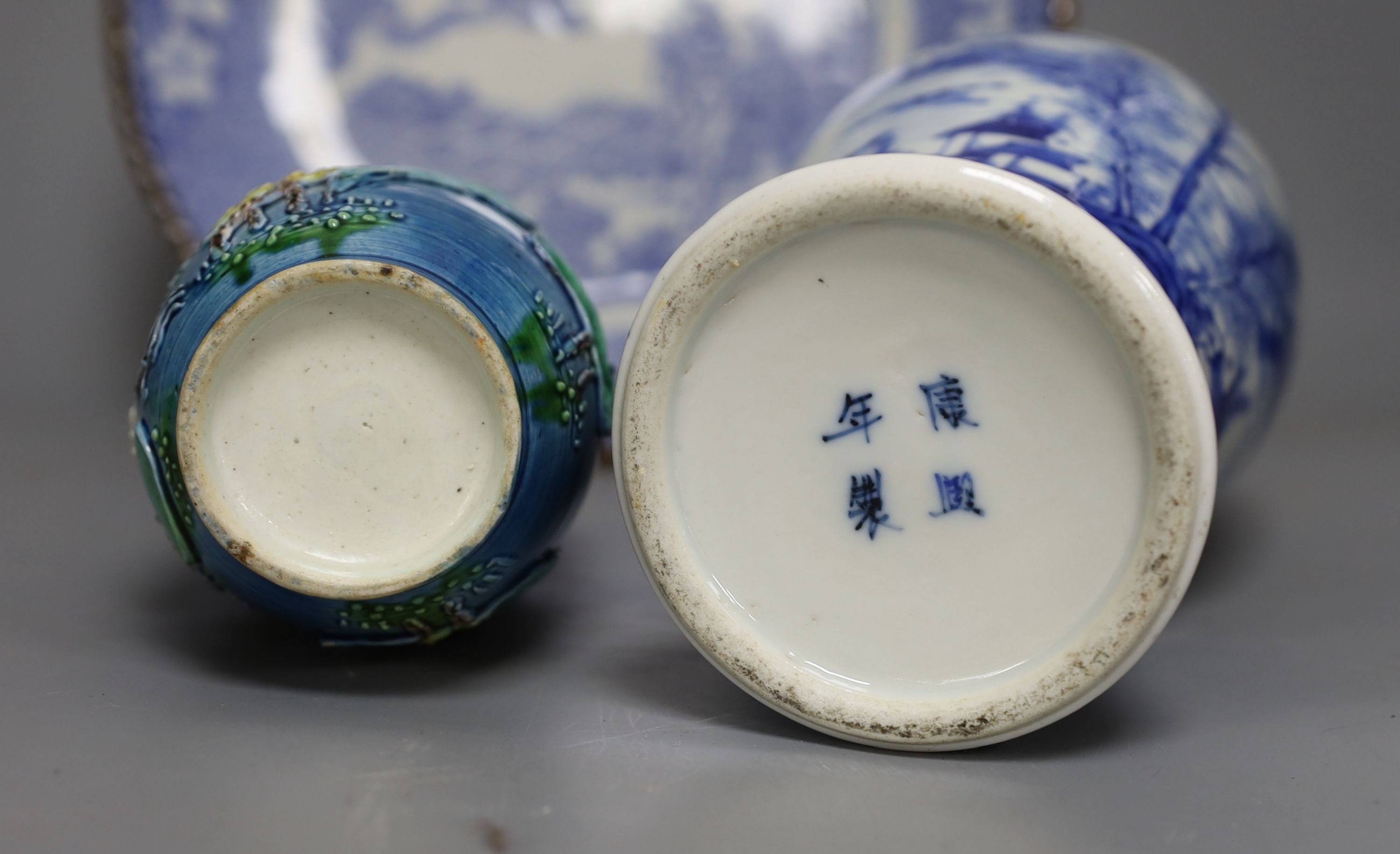 An early 20th century Chinese blue and white lidded vase together with a similar enamelled pottery vase and a Japanese blue and white dish. Tallest vase 29cm